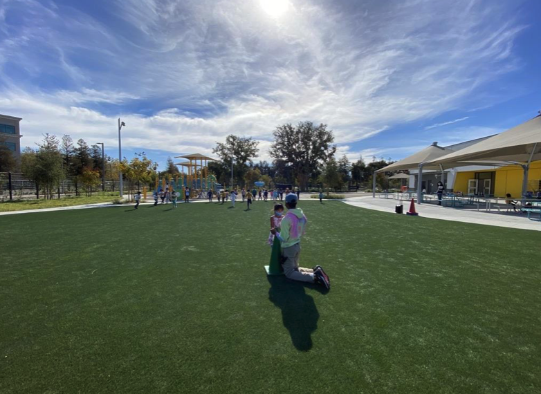 a parent and a child on a school playground