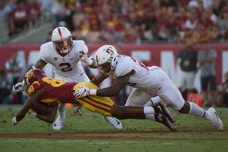 Football players making a tackle.