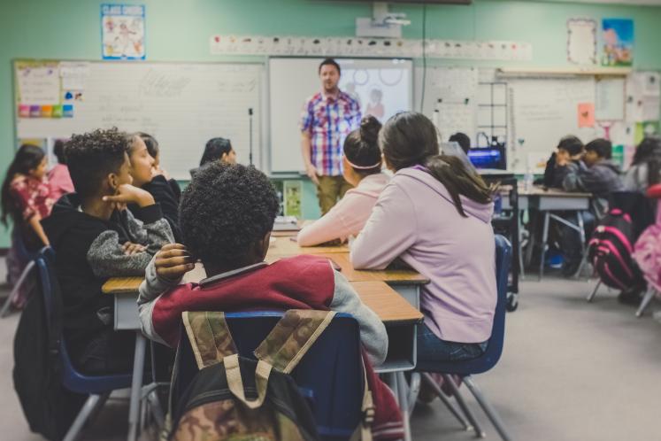 Teacher in front of classroom