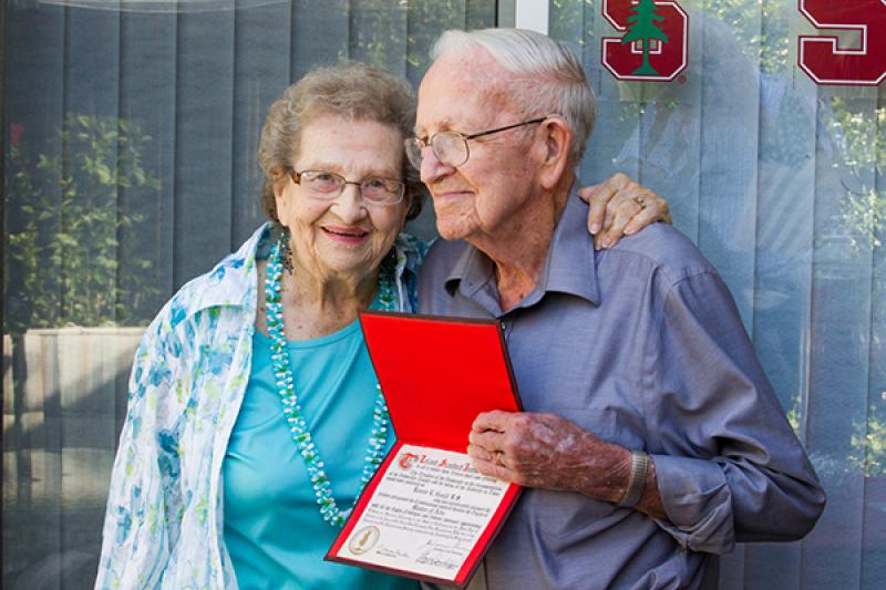 Margaret and Bonnie Gould show the Stanford diploma he received in 1954. This year he was able to participate in the ceremony he skipped 61 years ago. (Photo by Norbert von der Groeben)