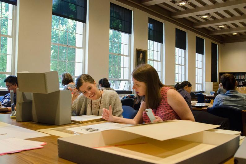 Teachers Esther Mansdorf and Erin Wilson examine source materials at the Hoover Institution Library and Archives as part of a pr