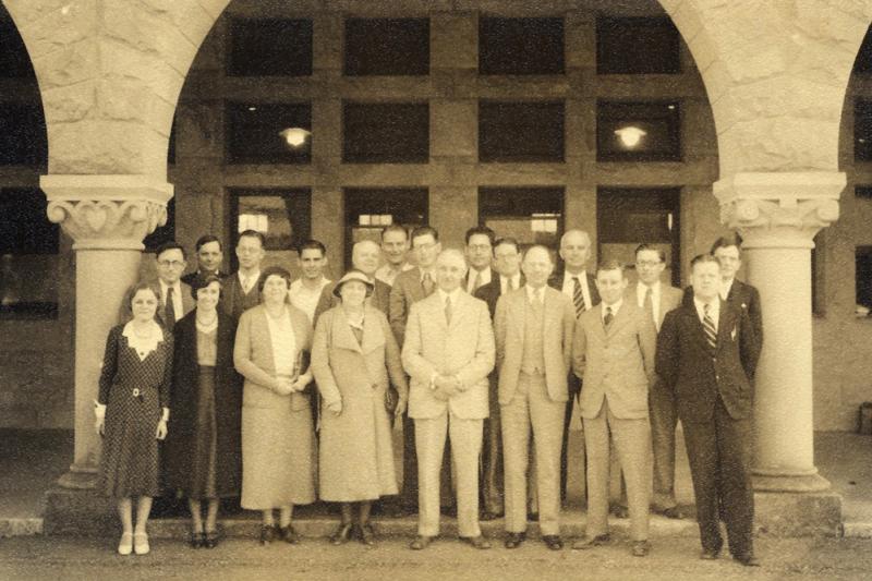 An old black and white photo of an earlier class of 20 students
