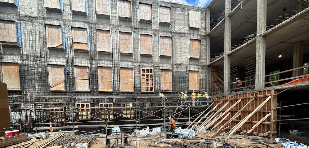 Construction workers shoring up supports for a wall of the historic north building in April 2024. (Photo: McCarthy Building Companies, Inc.)