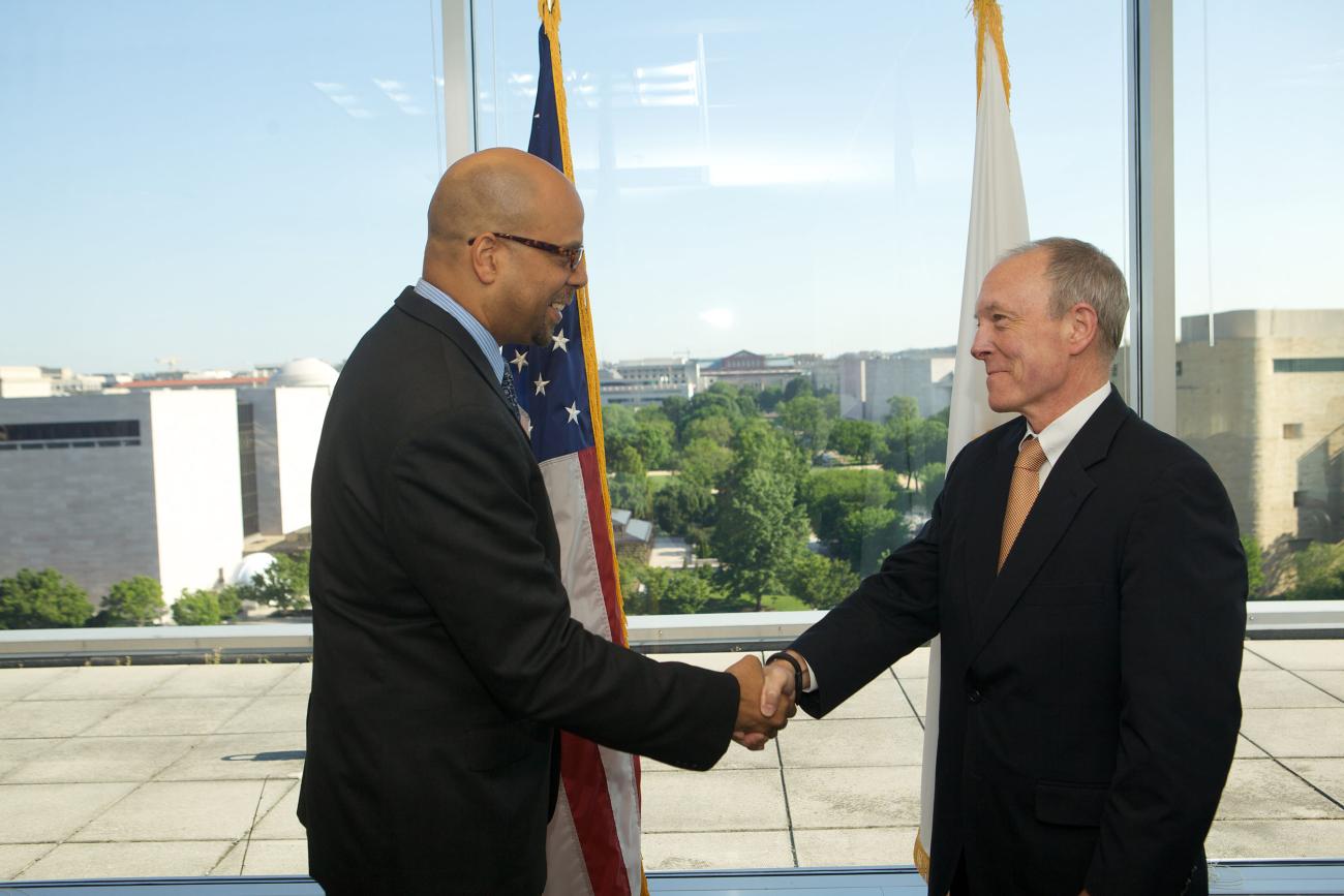Jim Shelton MA/MBA ’93, deputy secretary of education, swears in Ted Mitchell PhD '83 as under secretary of education.