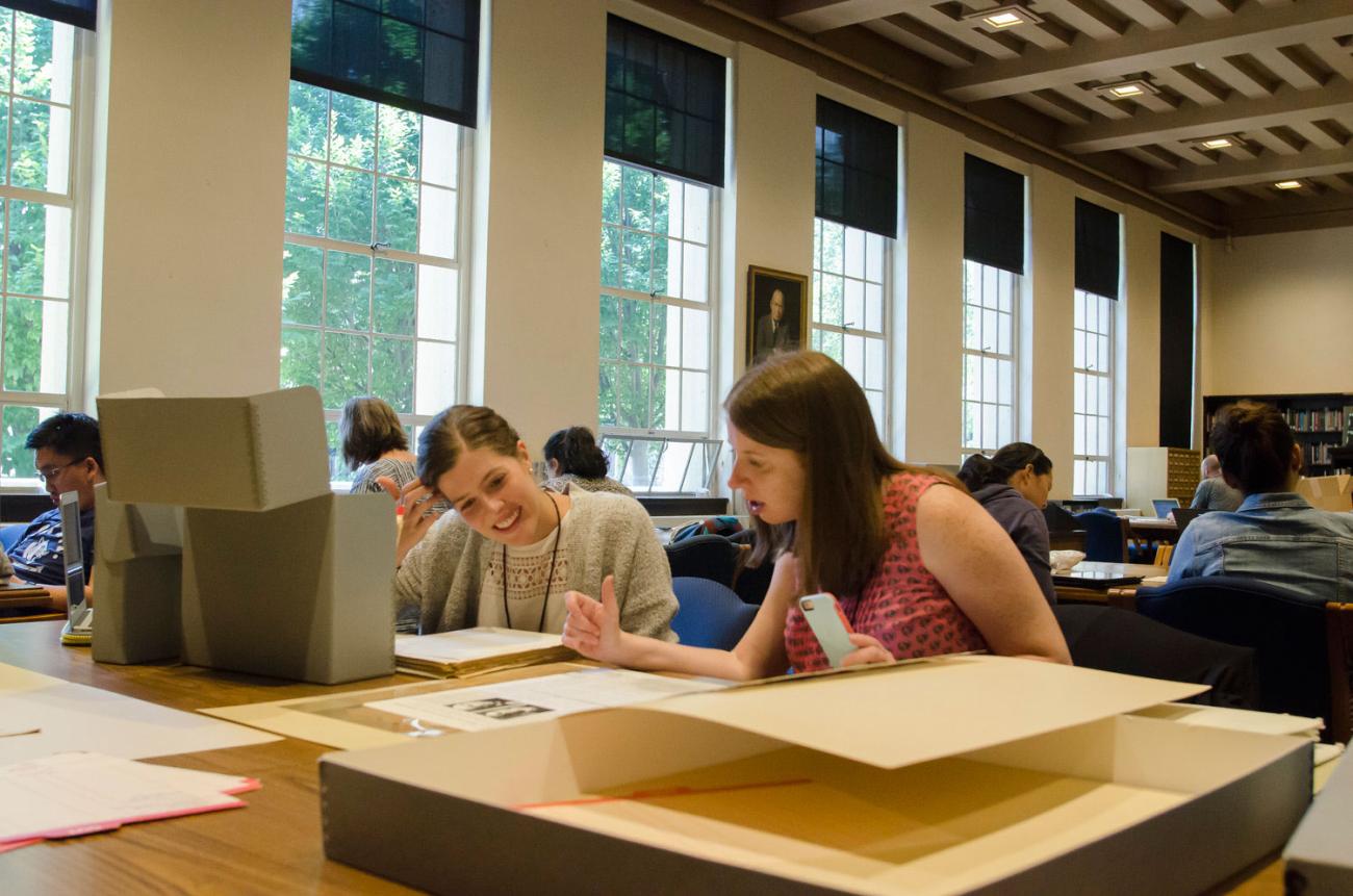 Teachers Esther Mansdorf and Erin Wilson examine source materials at the Hoover Institution Library and Archives as part of a pr